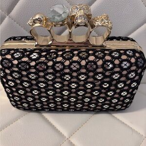Stylish Black Lace Clutch with Gold Knuckle Rings